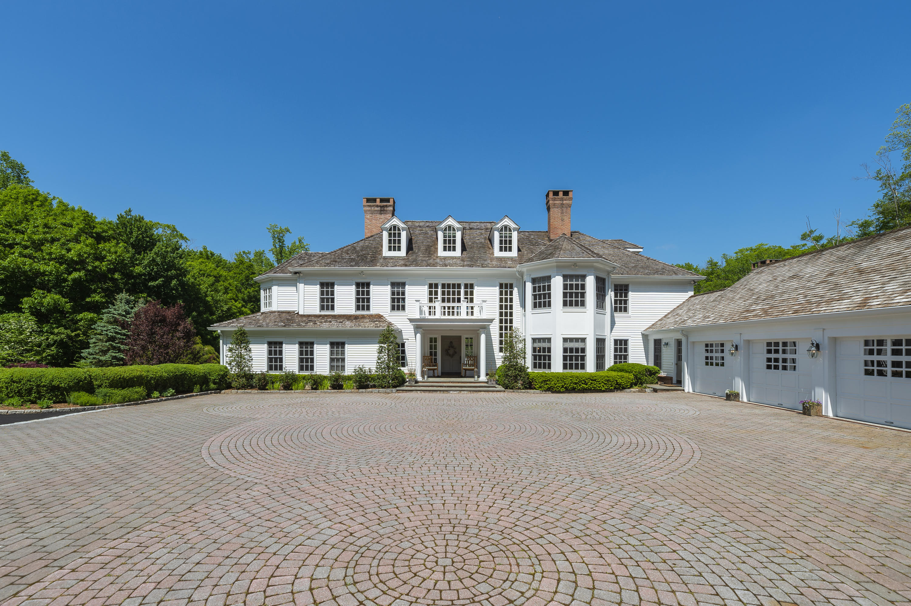 465 North Wilton Road New Canaan, CT 06840 - Photo 1 of 64 a front view of a building with garden