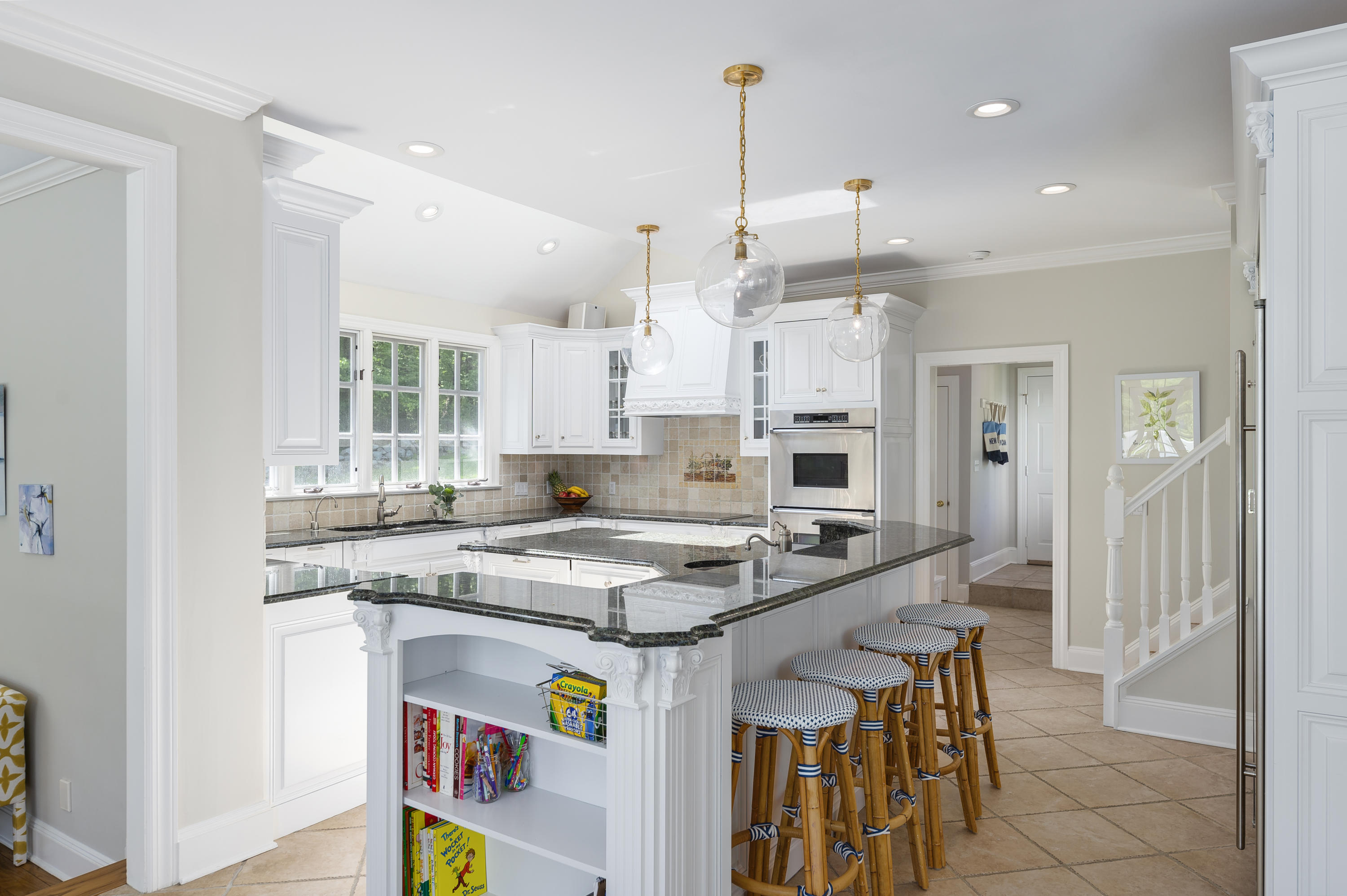 465 North Wilton Road New Canaan, CT 06840 - Photo 12 of 64 a kitchen with stainless steel appliances granite countertop a stove a sink and a refrigerator