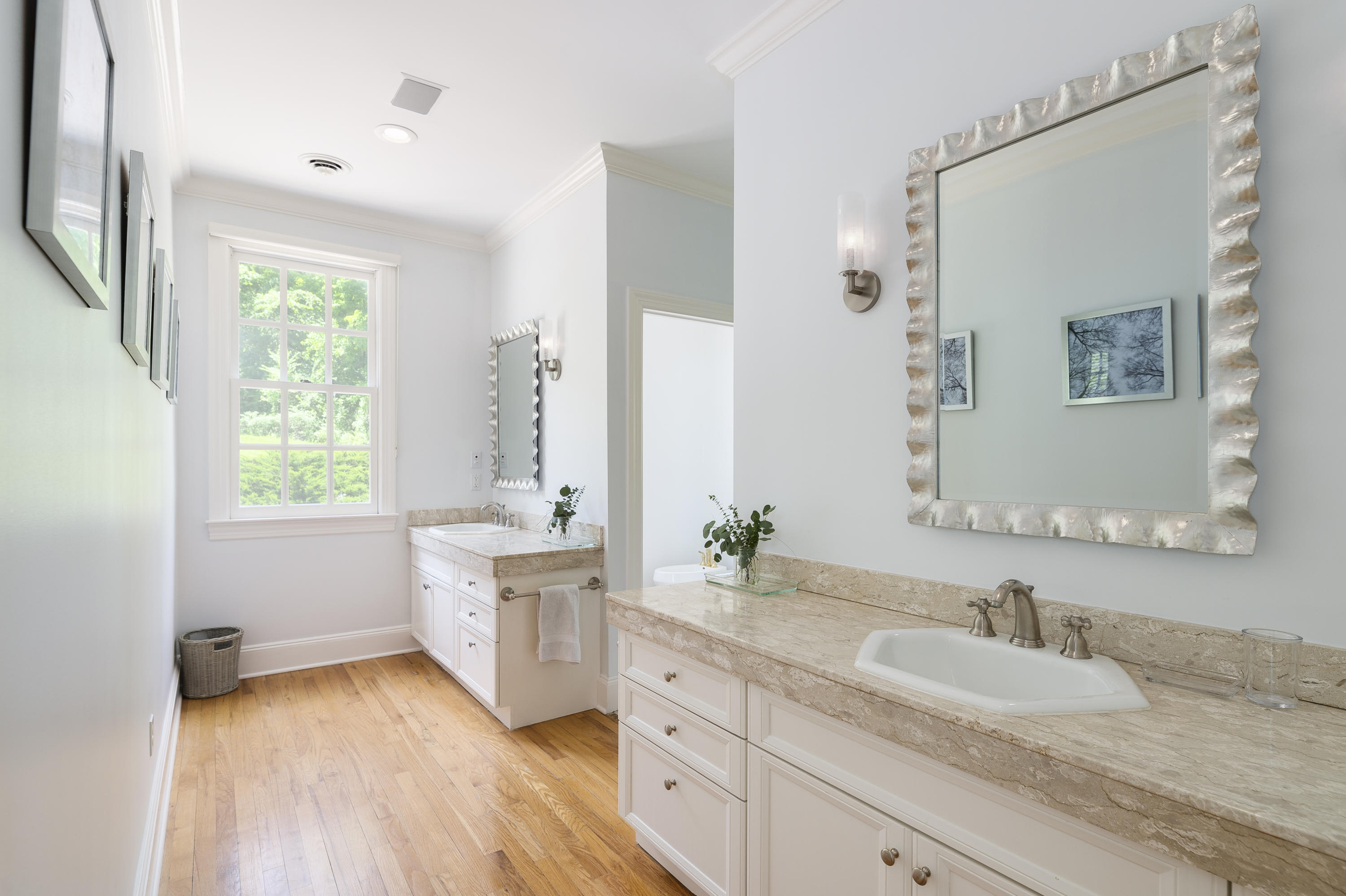 465 North Wilton Road New Canaan, CT 06840 - Photo 21 of 64 a spacious bathroom with a granite countertop sink and a mirror