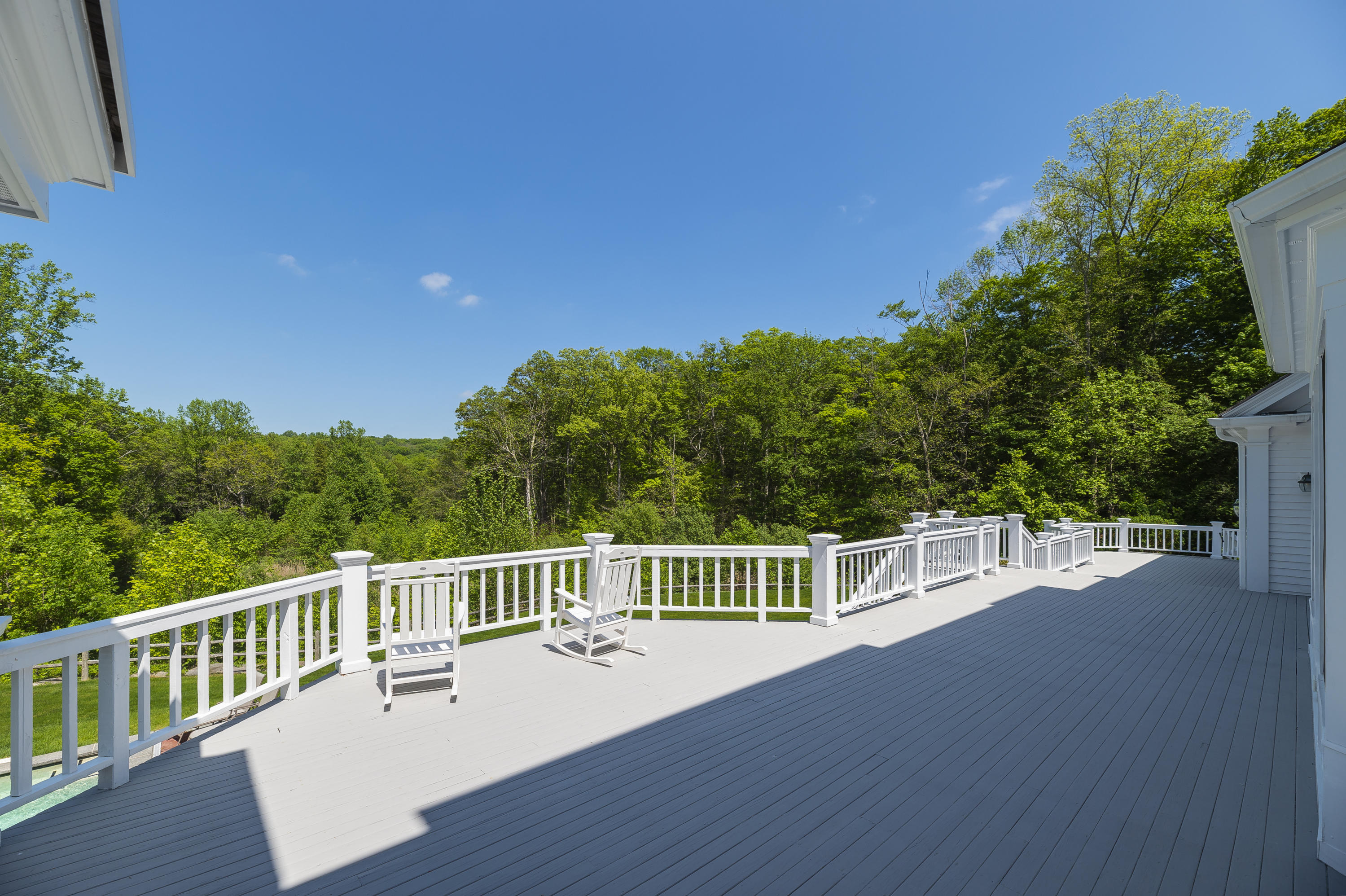 465 North Wilton Road New Canaan, CT 06840 - Photo 40 of 64 a view of a balcony with wooden floor