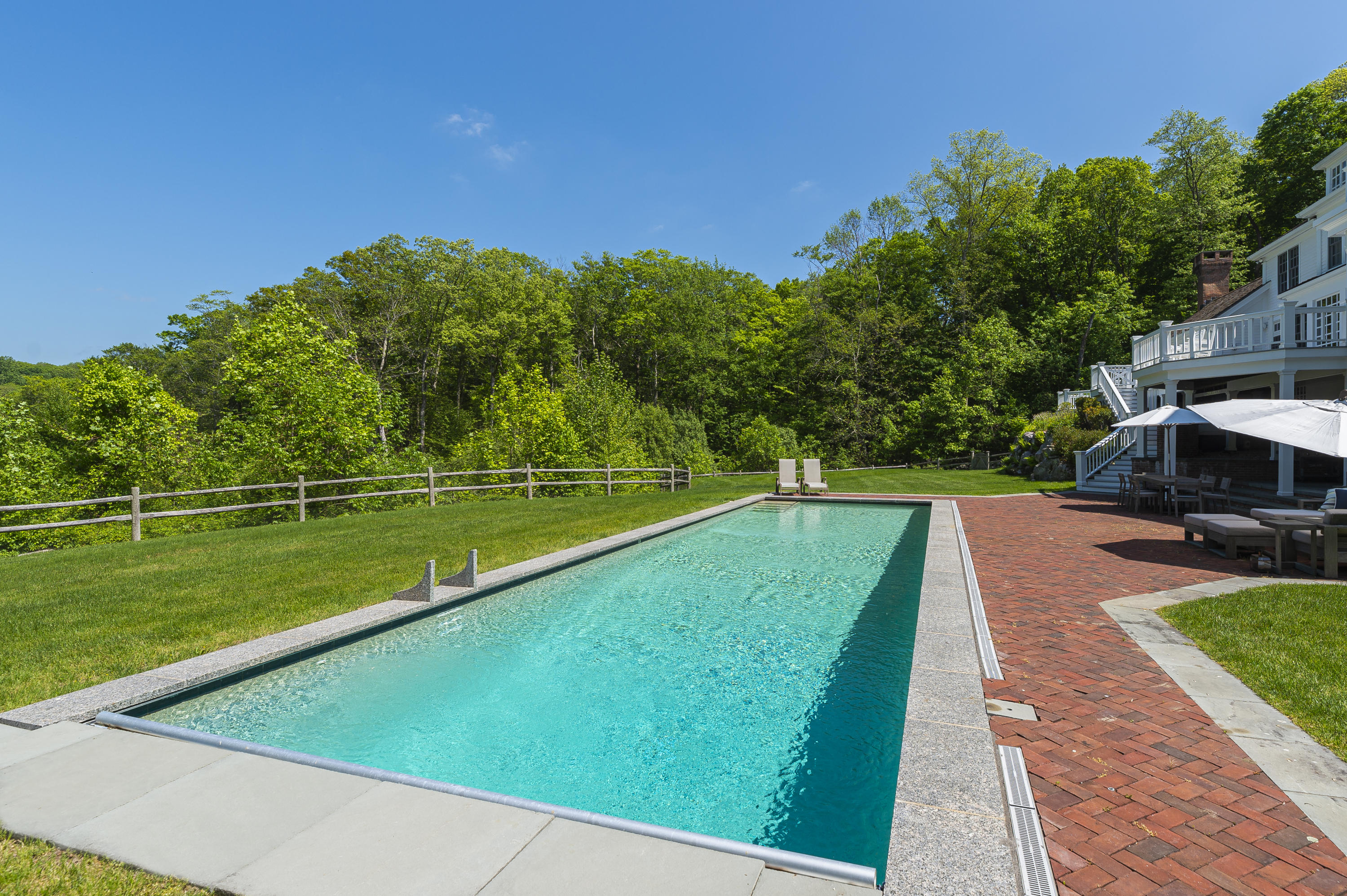465 North Wilton Road New Canaan, CT 06840 - Photo 45 of 64 a view of a swimming pool with a yard