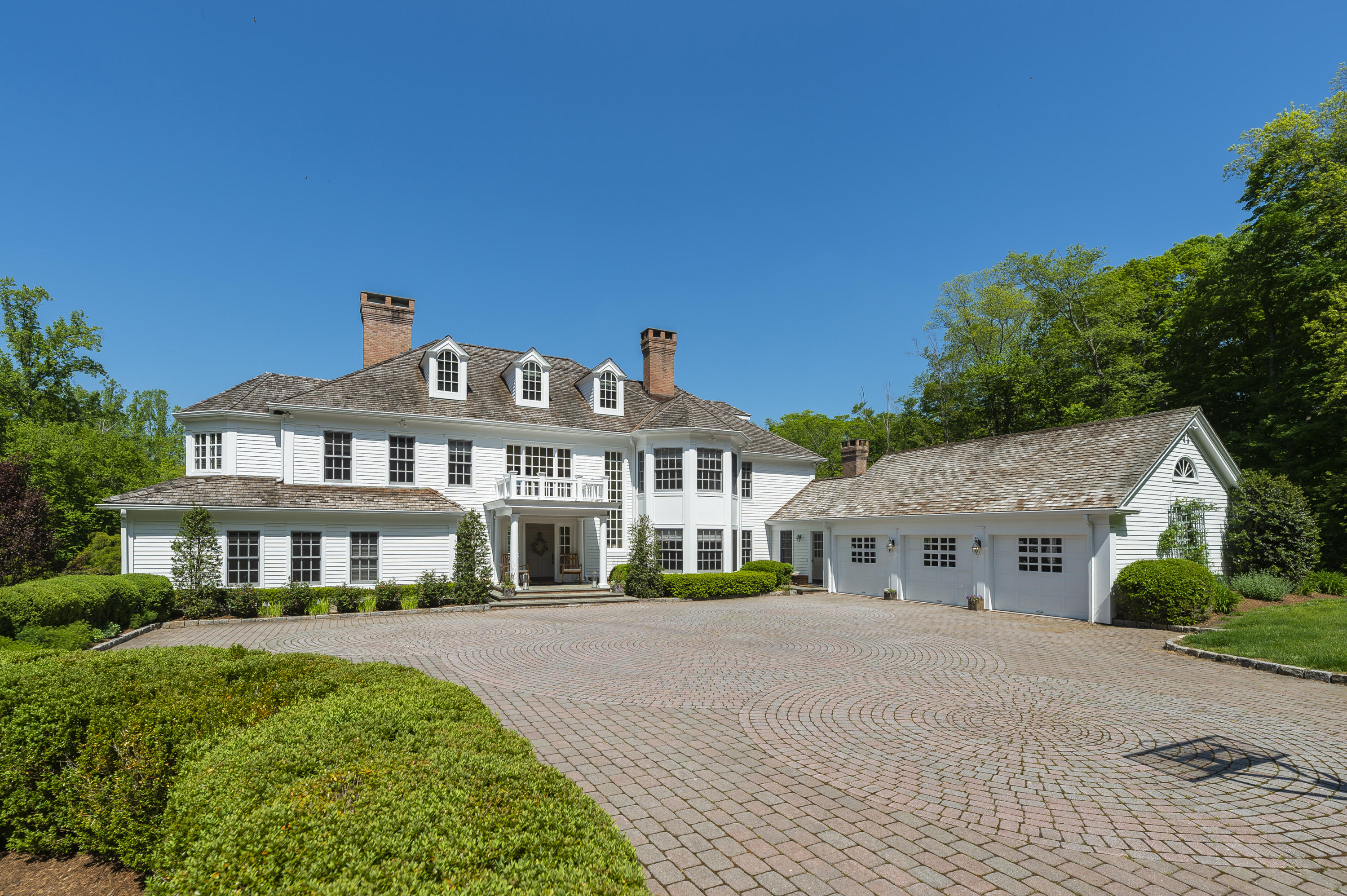 465 North Wilton Road New Canaan, CT 06840 - Photo 48 of 64 a front view of a house with a yard