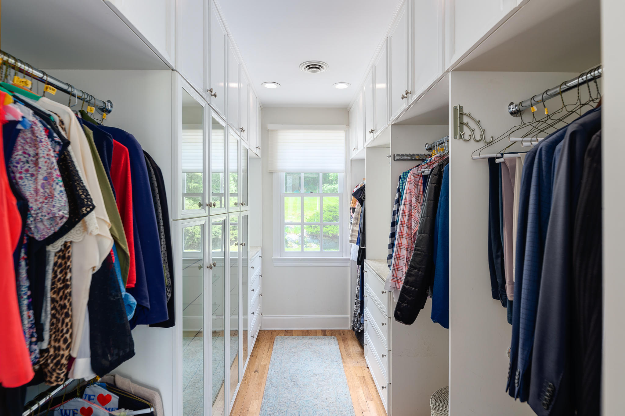 465 North Wilton Road New Canaan, CT 06840 - Photo 55 of 64 a view of walk in closet with clothes and shoes