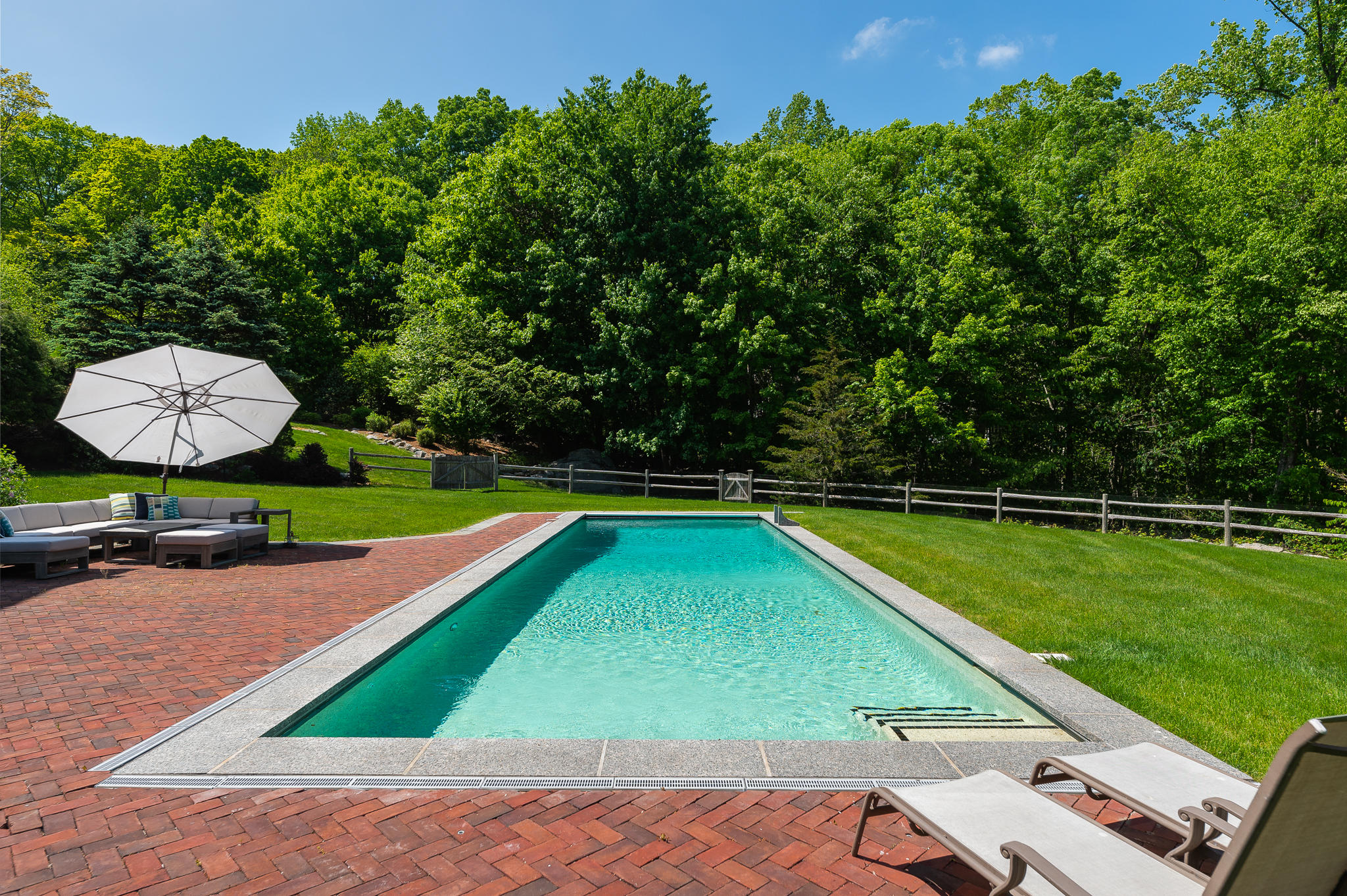 465 North Wilton Road New Canaan, CT 06840 - Photo 61 of 64 a view of a backyard with swimming pool
