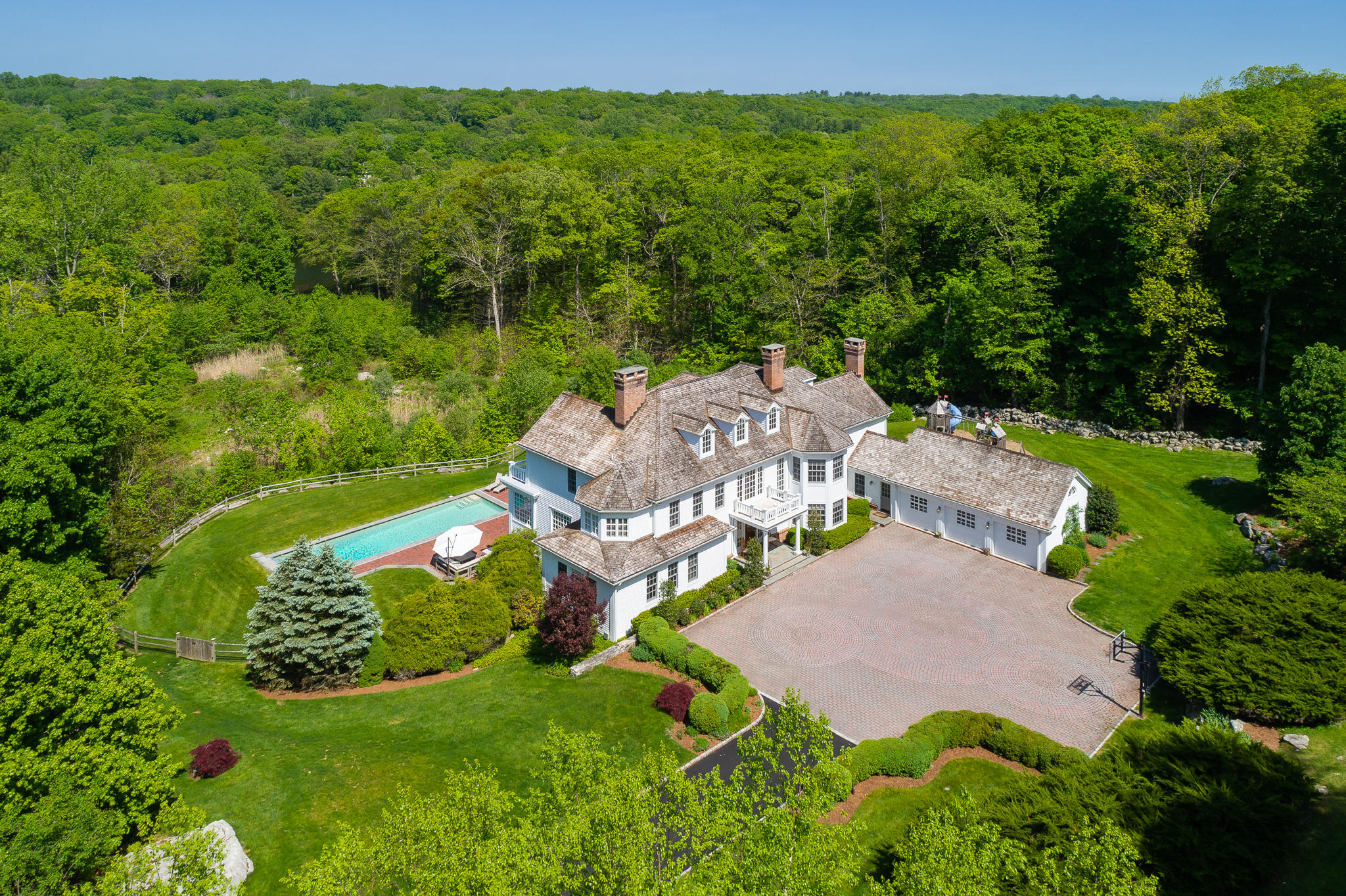 465 North Wilton Road New Canaan, CT 06840 - Photo 62 of 64 an aerial view of a house with a garden
