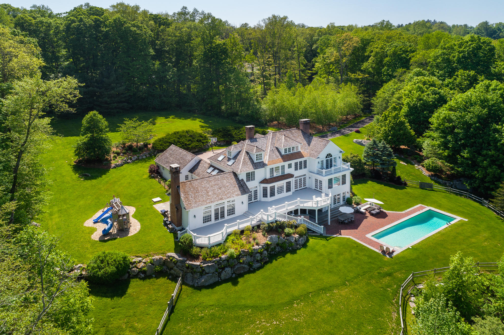 465 North Wilton Road New Canaan, CT 06840 - Photo 64 of 64 an aerial view of a house with pool garden and outdoor seating