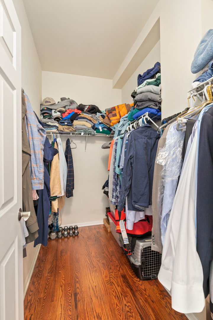 657 West Fulton Street, Unit 705 Chicago, IL 60661 - Photo 18 of 24 a view of walk in closet with clothes and shoes