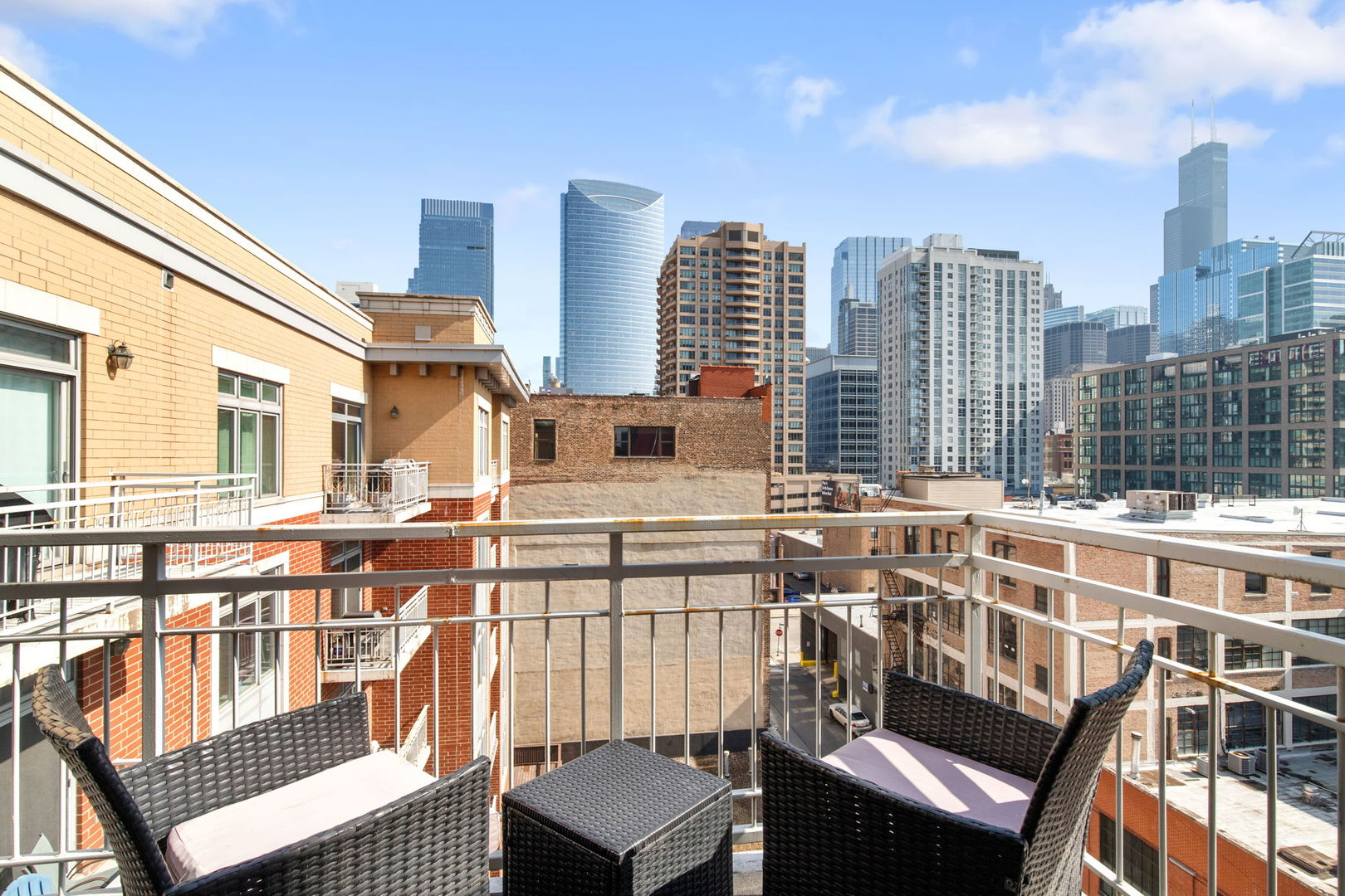 657 West Fulton Street, Unit 705 Chicago, IL 60661 - Photo 7 of 24 a view of a balcony with chairs