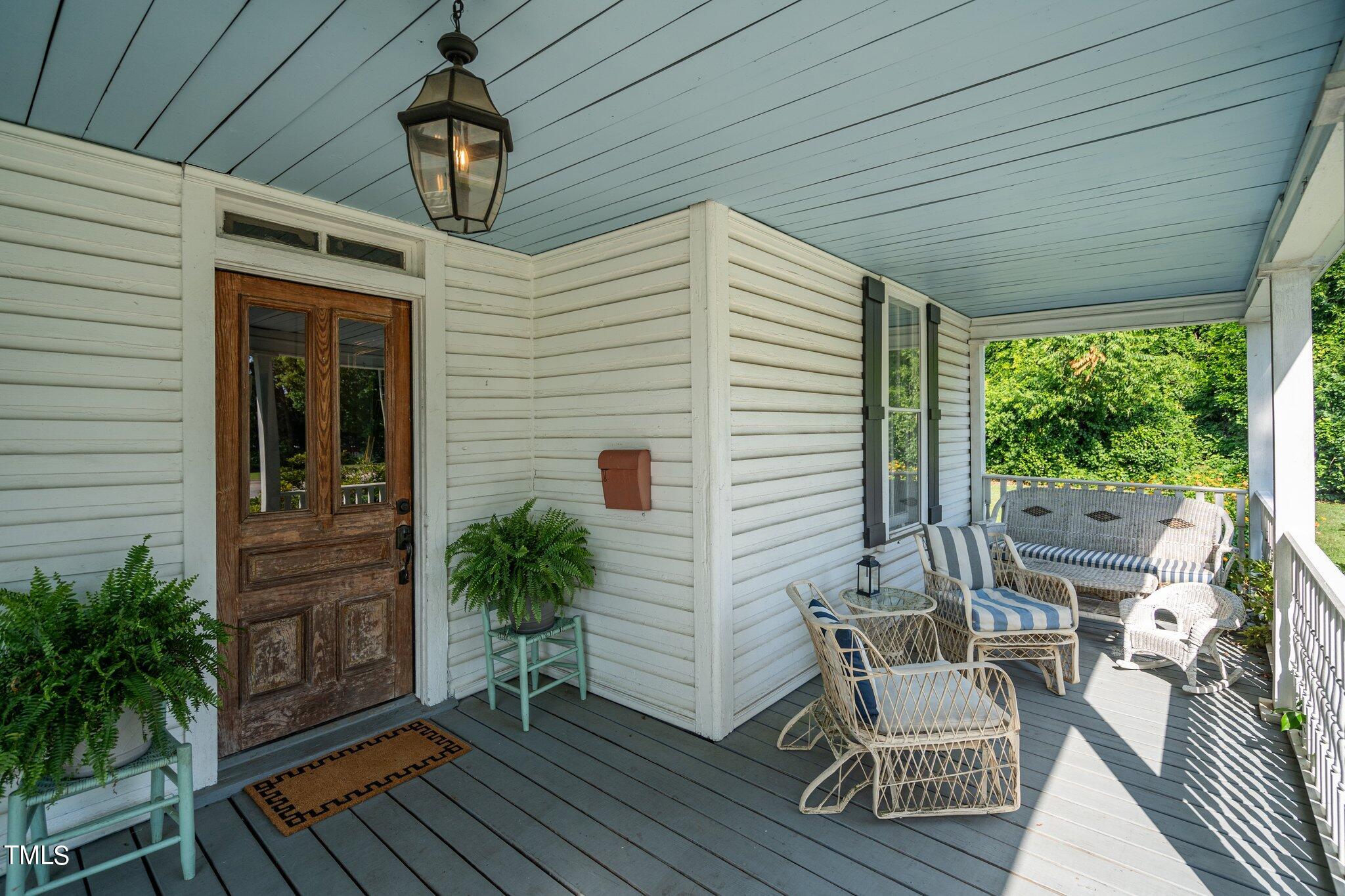 401 East Garner Road Garner, NC 27529 - Photo 2 of 56 a porch with seating space