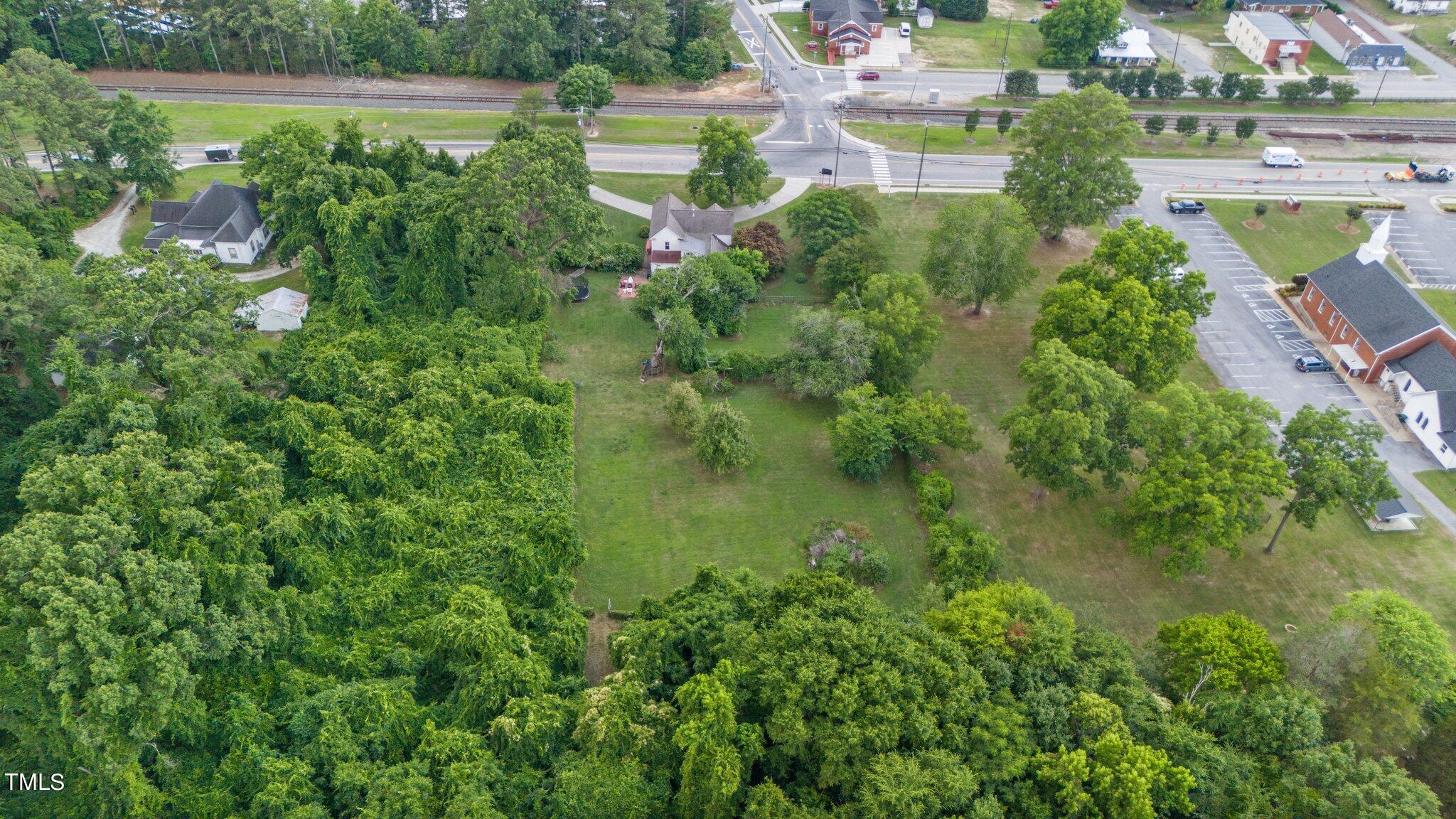 401 East Garner Road Garner, NC 27529 - Photo 54 of 56 an aerial view of a house with pool outdoor seating and yard