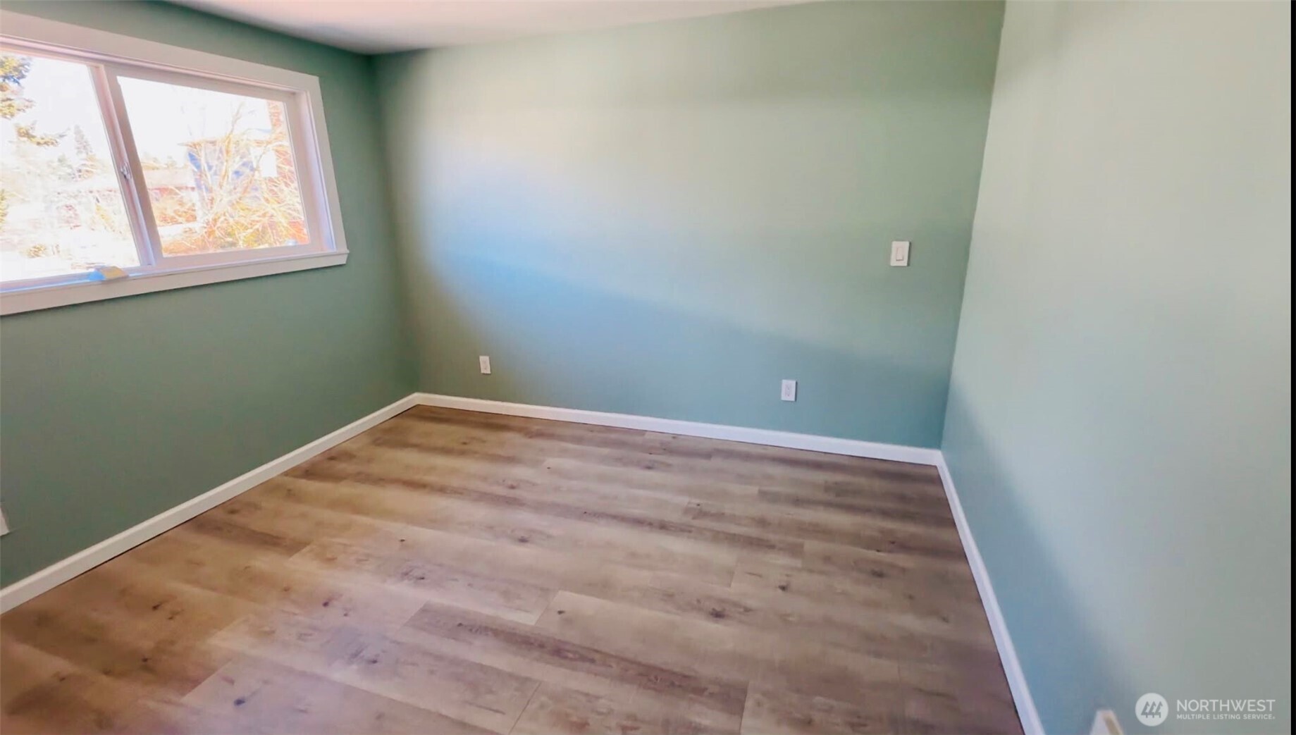 9040 17th Avenue Southwest Seattle, WA 98106 - Photo 11 of 34 an empty room with windows