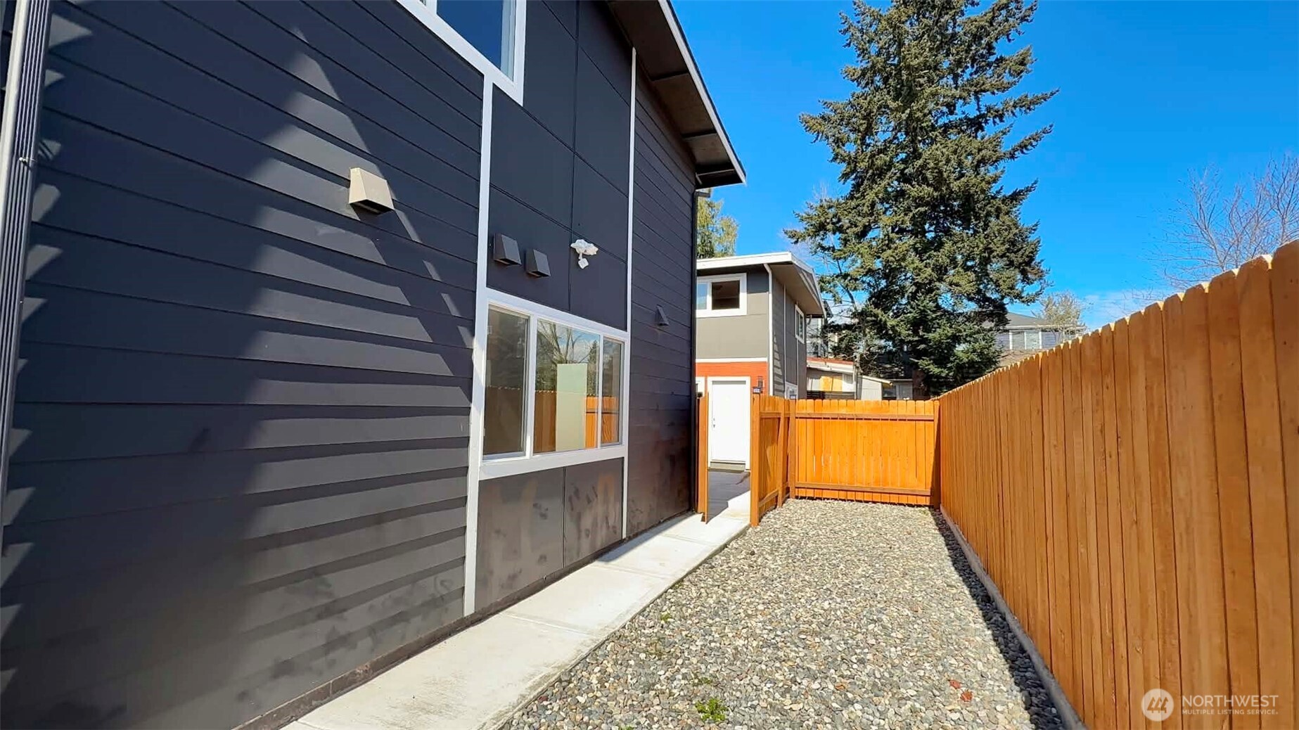 9040 17th Avenue Southwest Seattle, WA 98106 - Photo 15 of 34 a view of a house with a backyard