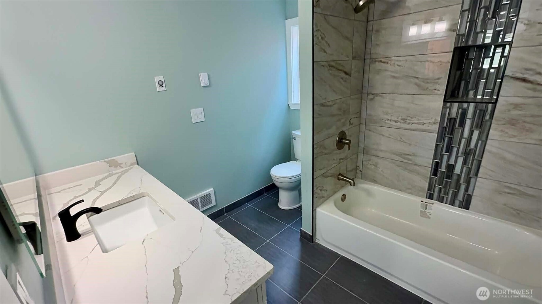 9040 17th Avenue Southwest Seattle, WA 98106 - Photo 24 of 34 a bathroom with a sink and toilet
