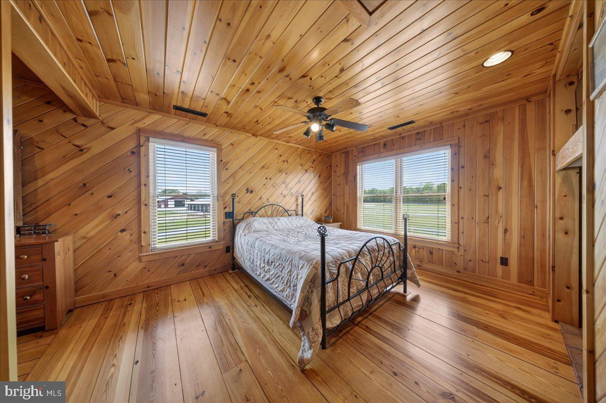 10036 Redden Road Bridgeville, DE 19933 - Photo 26 of 53 a bed sitting in a spacious bedroom next to a window