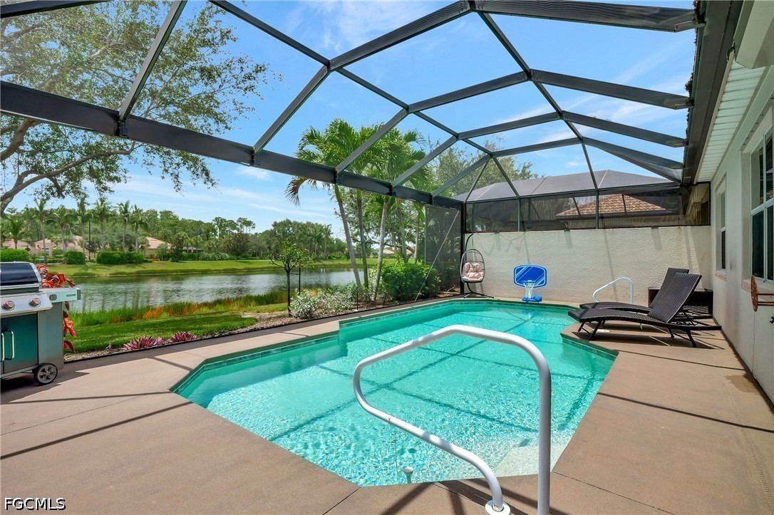 11230 Suffield Street Fort Myers, FL 33913 - Photo 26 of 42 a view of a swimming pool with a patio and a lake view