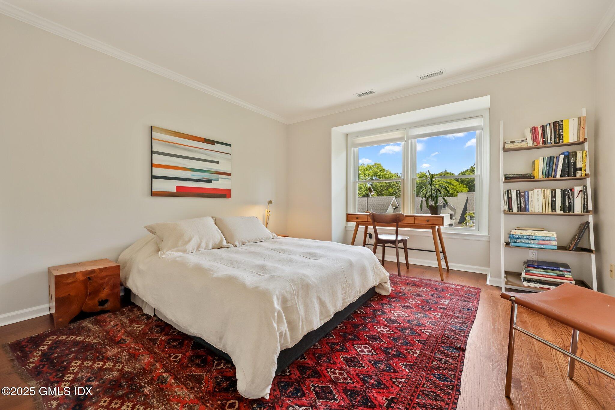 172 Field Point Road, Unit 9 Greenwich, CT 06830 - Photo 16 of 20 a bed sitting in a bedroom next to a window