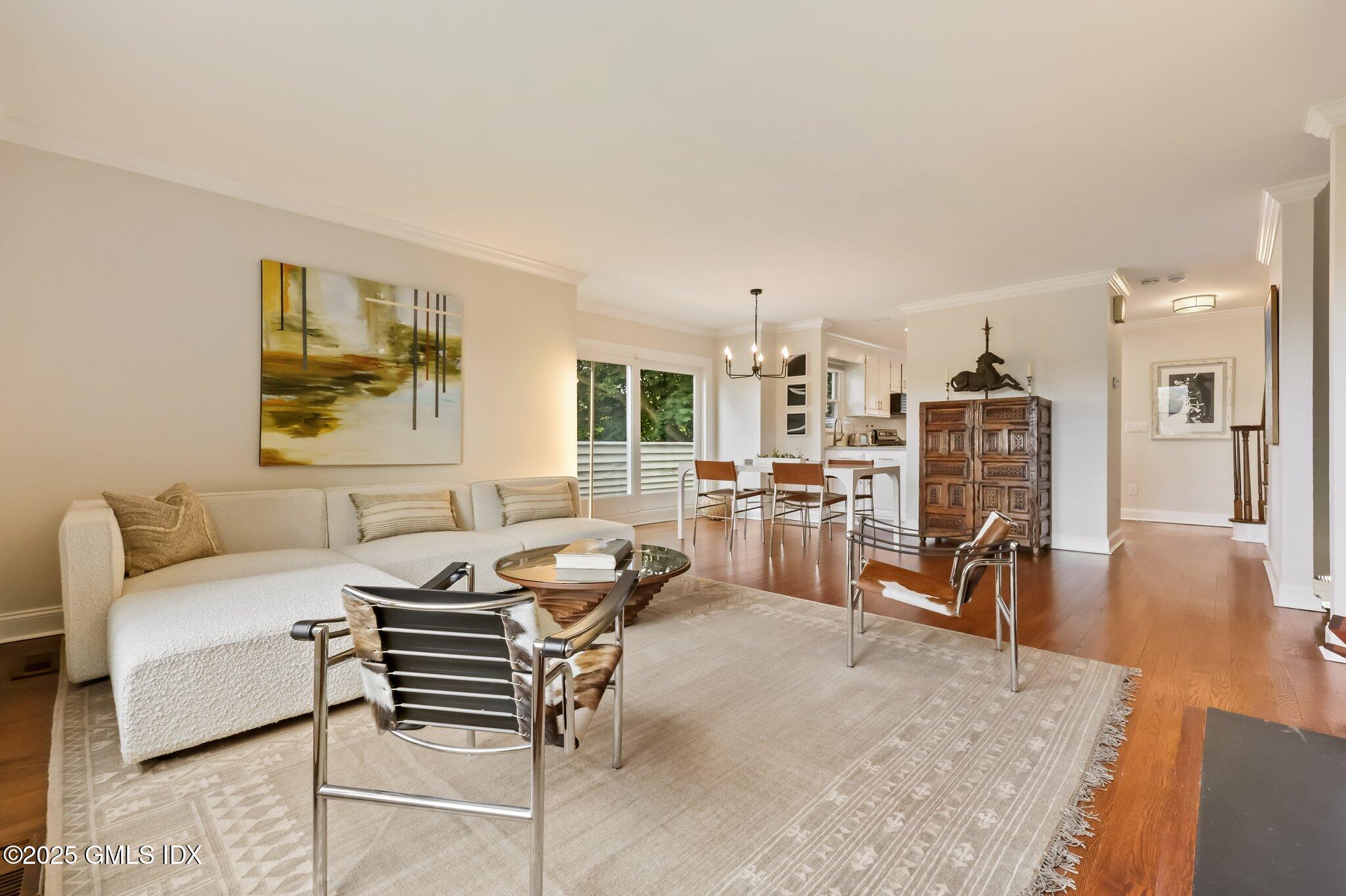 172 Field Point Road, Unit 9 Greenwich, CT 06830 - Photo 5 of 20 a living room with furniture and a table