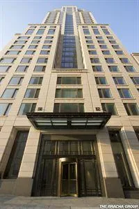 a bathroom with a granite countertop double vanity sink double mirror