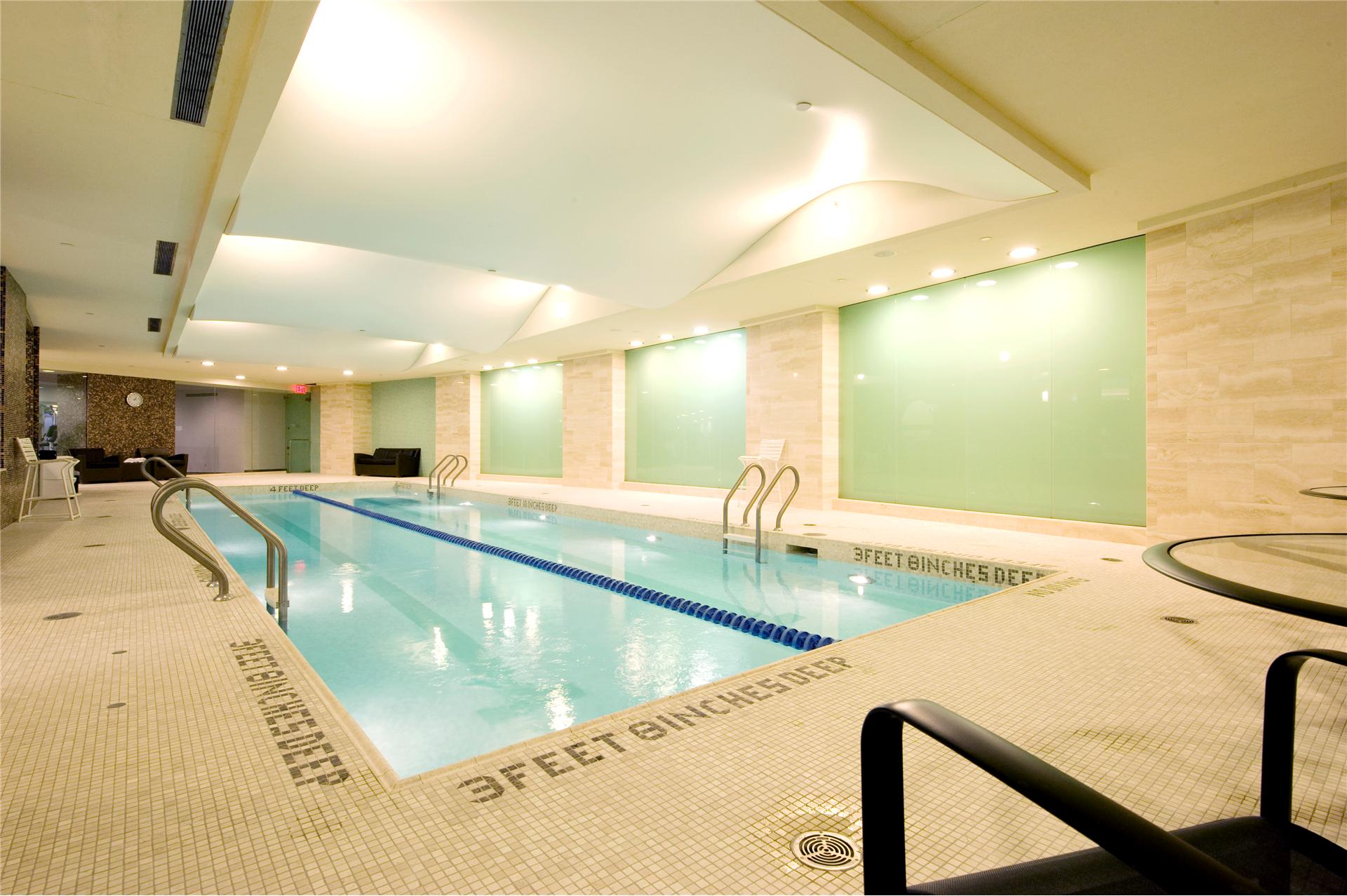 240 Riverside Boulevard, Unit 21C Manhattan, NY 10069 - Photo 22 of 32 a view of a kitchen counter top a sink and a dishwasher with wooden floor