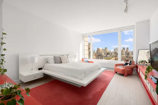 a kitchen with stainless steel appliances granite countertop a stove a sink dishwasher a microwave oven and a refrigerator with wooden cabinets