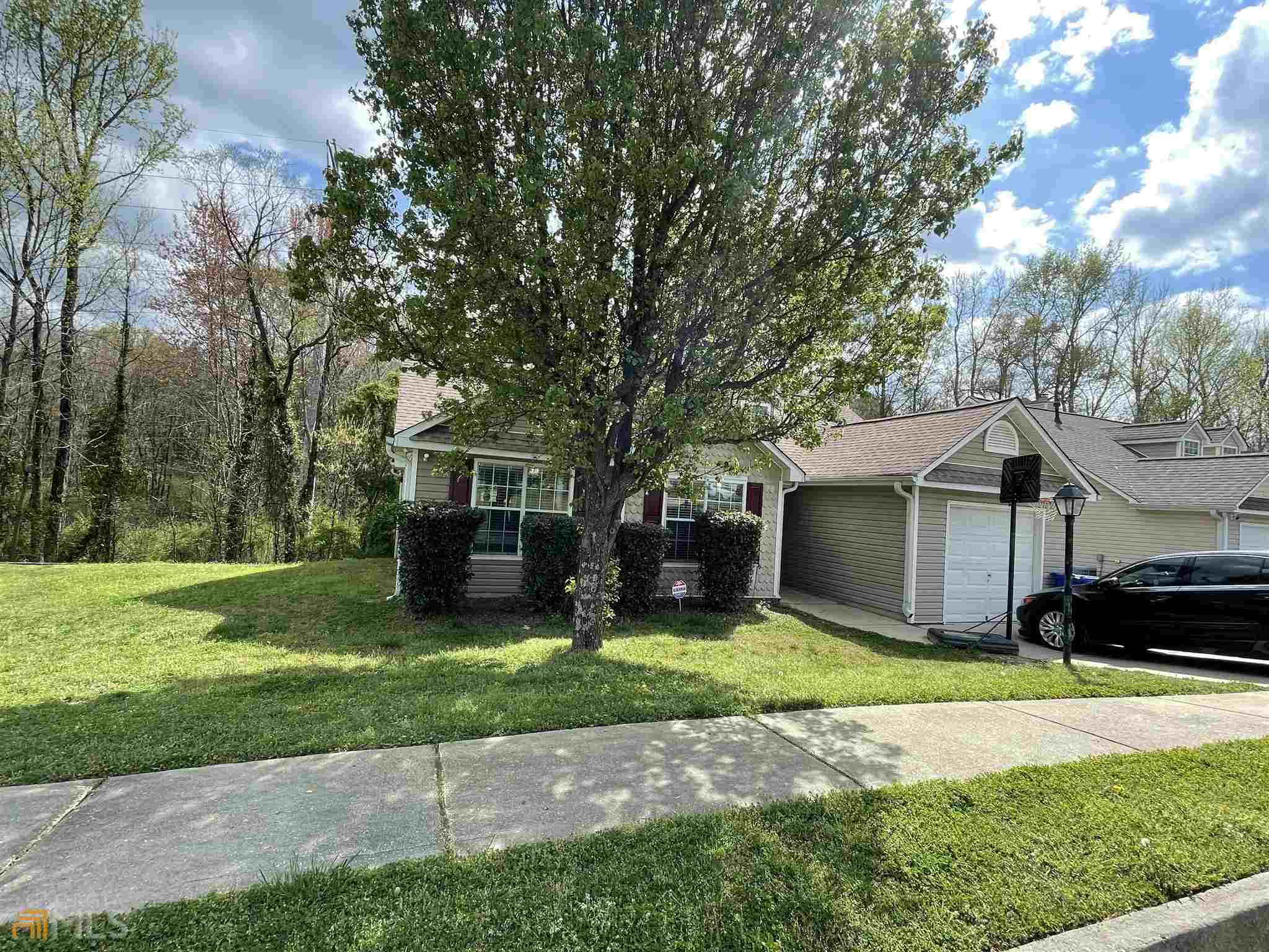 245 Misty Ridge Trail Stockbridge, GA 30281 - Photo 1 of 1 a view of a house with a yard