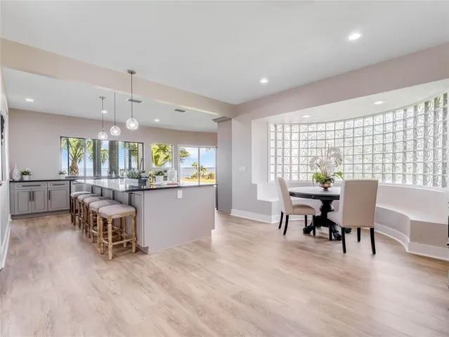 a view of a dining room with furniture and a window