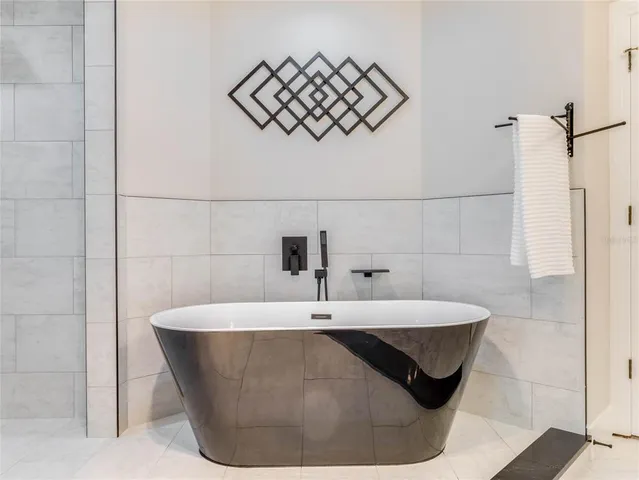 front view of a house with a yard and an trees