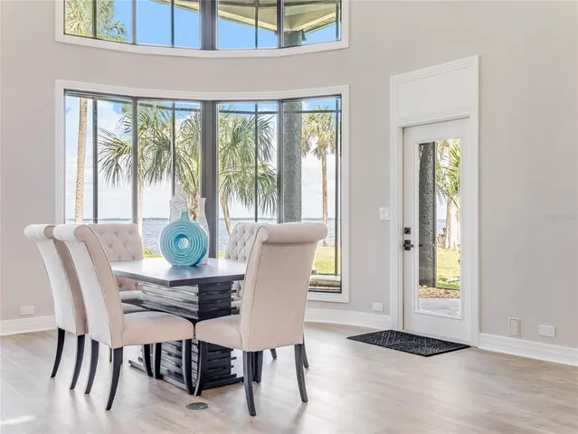a living room with furniture and a glass door