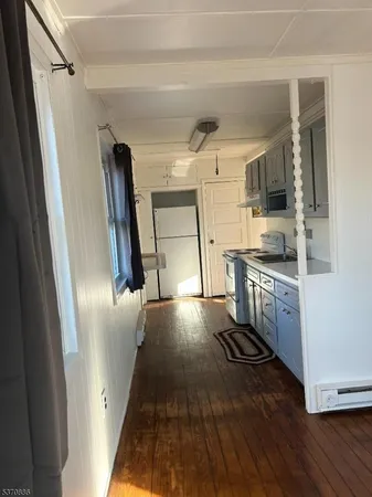 a kitchen with stainless steel appliances a refrigerator and a stove