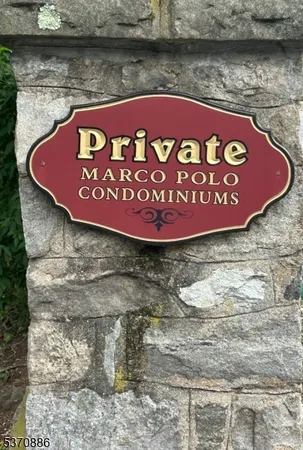 a sign that is on the side of a lake