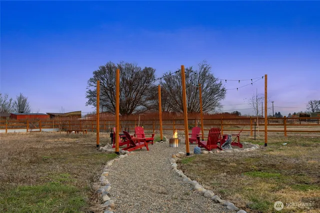 a view of a park with large trees