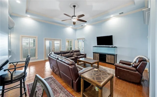 a living room with furniture and a fireplace