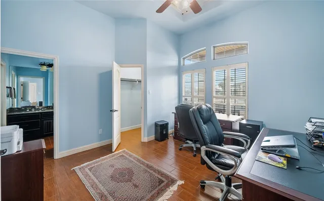 a workspace with furniture and wooden floor