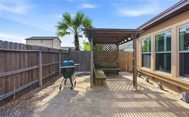 a front view of a house with outdoor seating