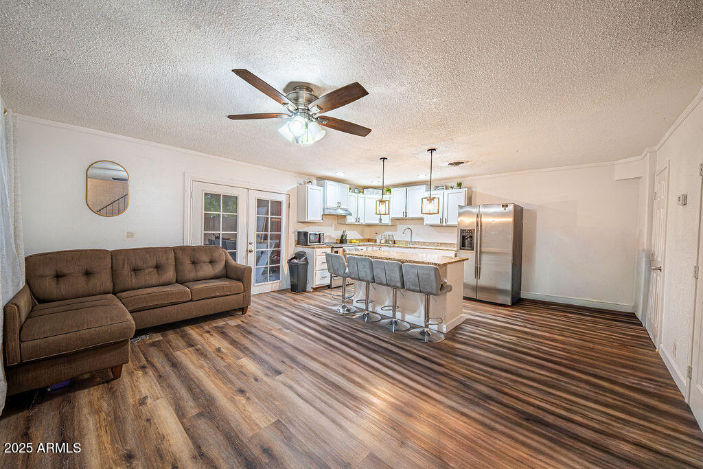 4233 North 68th Avenue Phoenix, AZ 85033 - Photo 1 of 11 a living room with stainless steel appliances furniture and a rug