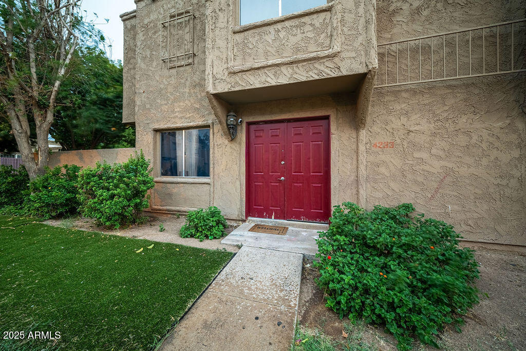 4233 North 68th Avenue Phoenix, AZ 85033 - Photo 11 of 11 a front view of a house with a yard
