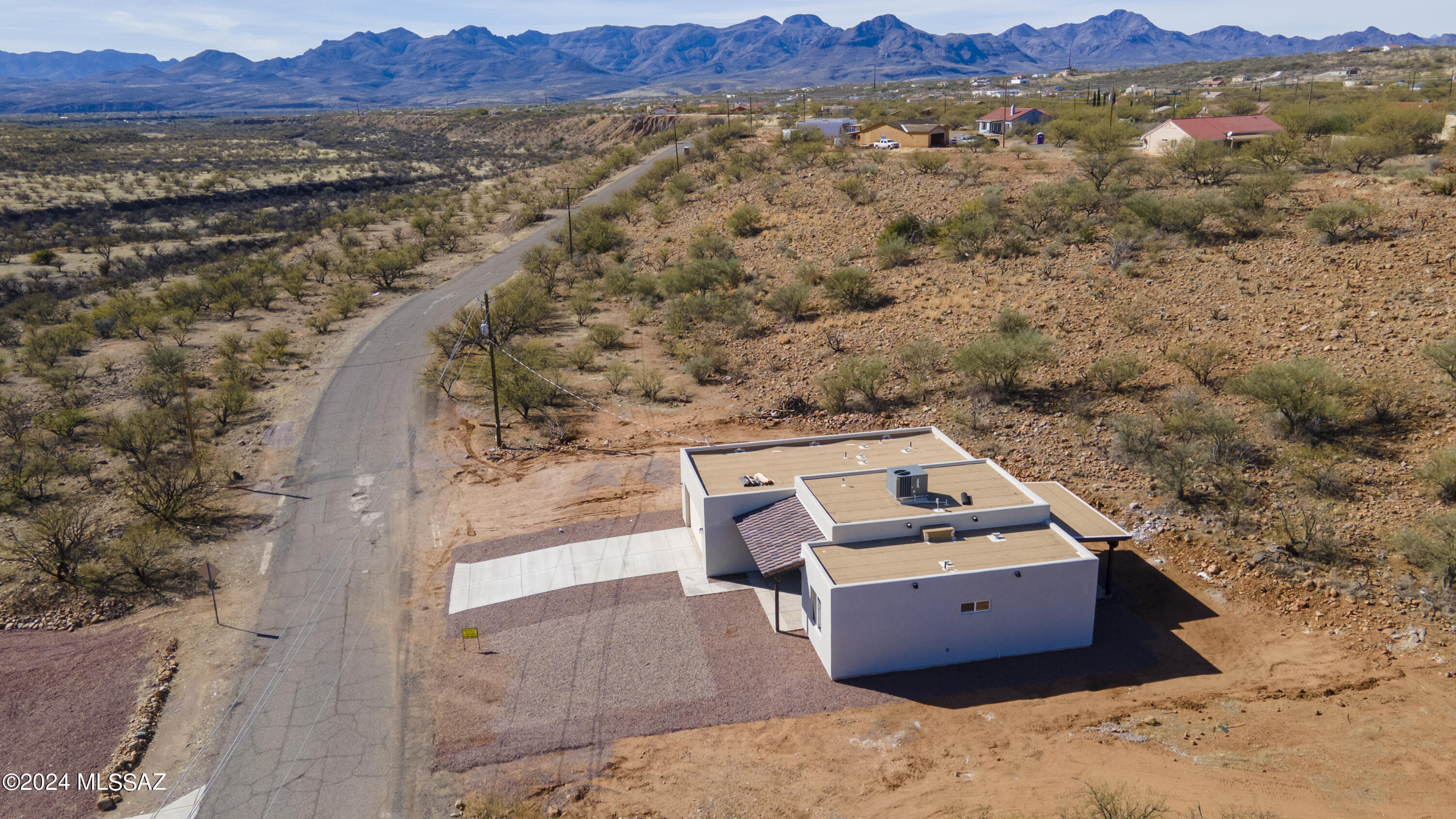 1817 Vereda Iberia Rio Rico, AZ 85648 - Photo 6 of 25 an aerial view of a house with a yard and mountain view