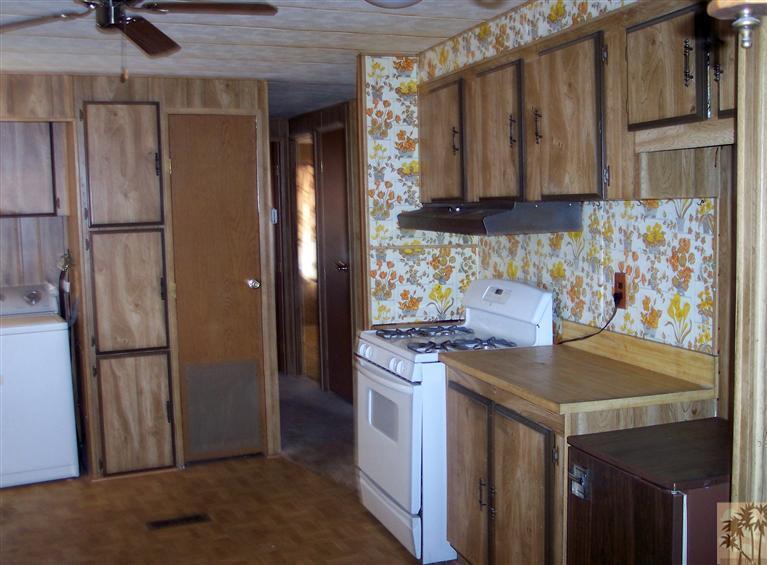 18555 Roberts Road, Unit 36 Desert Hot Springs, CA 92241 - Photo 14 of 20 a kitchen with stainless steel appliances granite countertop a refrigerator and a stove