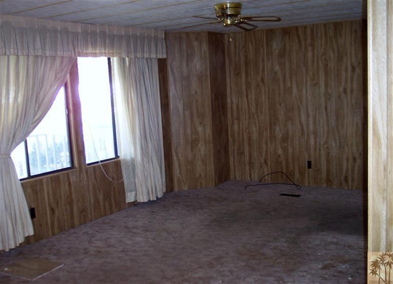 18555 Roberts Road, Unit 36 Desert Hot Springs, CA 92241 - Photo 6 of 20 a view of an empty room with a window
