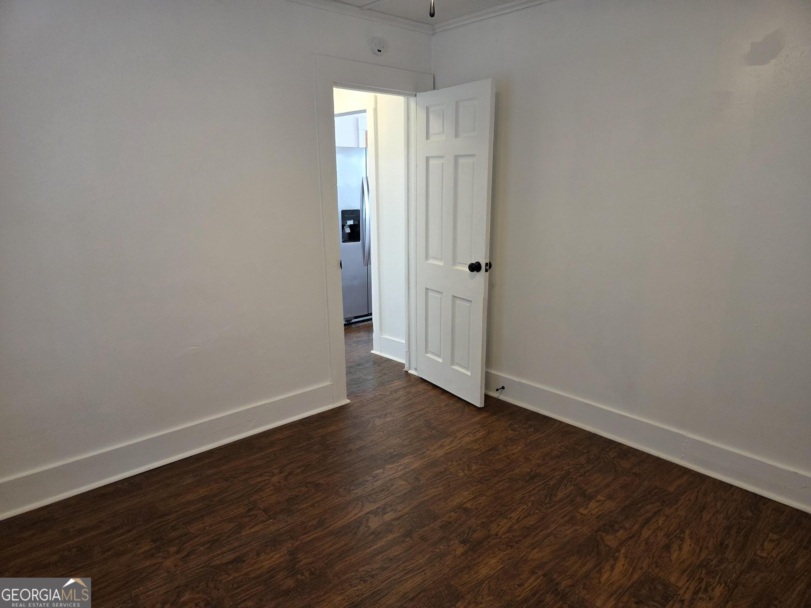 1502 Monck Street Brunswick, GA 31520 - Photo 14 of 32 a view of an empty room with wooden floor