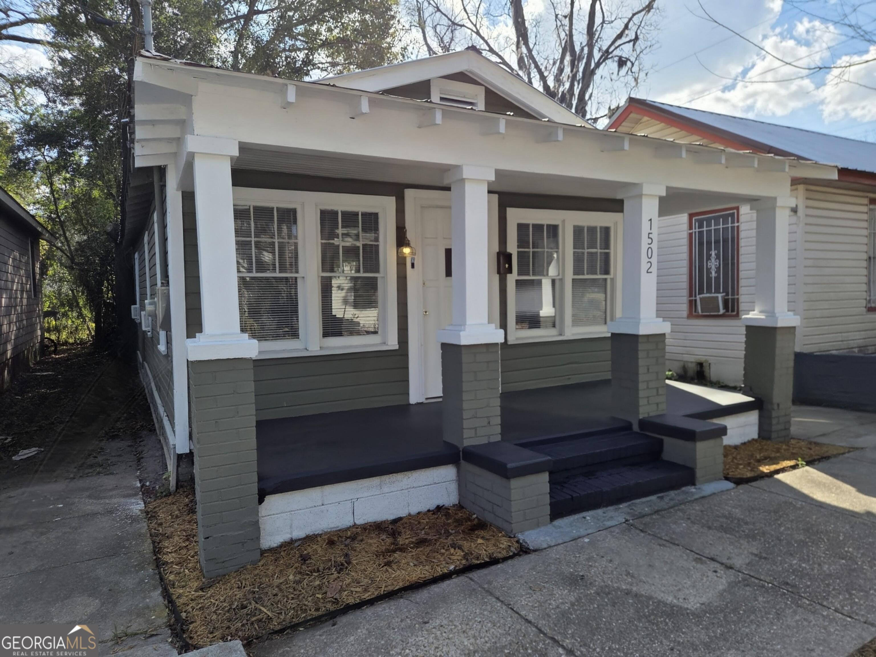 1502 Monck Street Brunswick, GA 31520 - Photo 2 of 32 a view of a house with a yard and sitting area