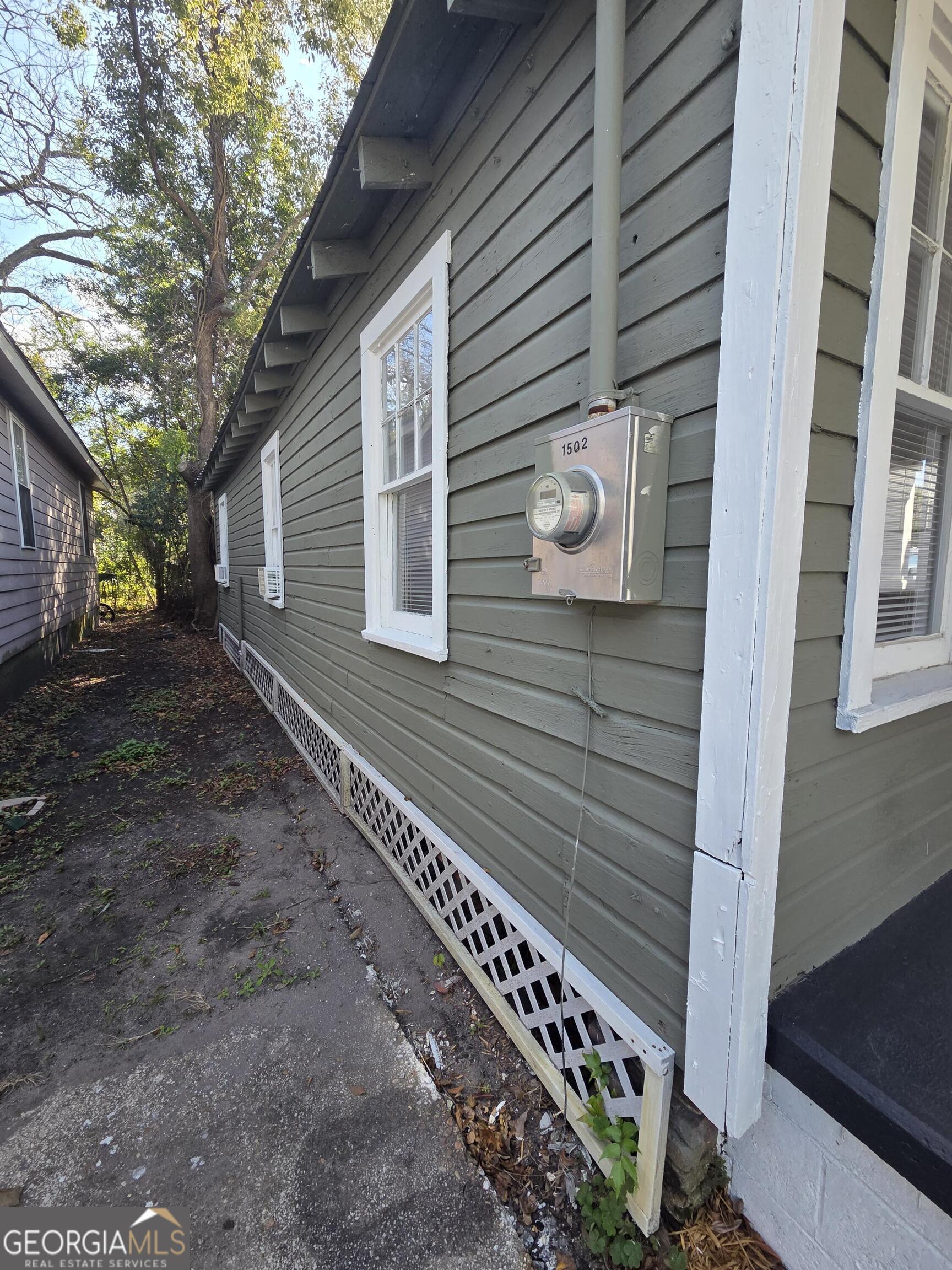 1502 Monck Street Brunswick, GA 31520 - Photo 30 of 32 a view of a house with a yard
