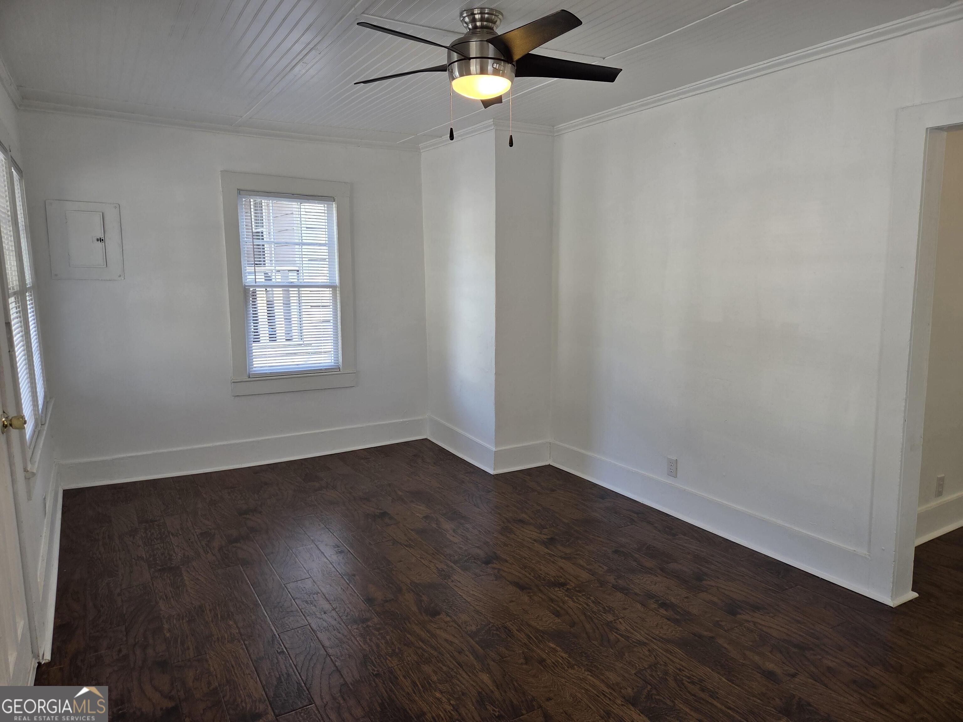 1502 Monck Street Brunswick, GA 31520 - Photo 5 of 32 a view of empty room with wooden floor and fan