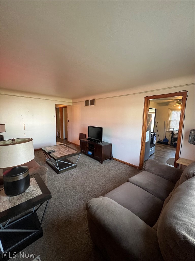 3892 East 189th Street Cleveland, OH 44122 - Photo 4 of 16 Carpeted living room featuring ceiling fan