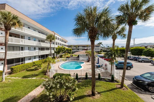 a swimming pool with outdoor seating and yard