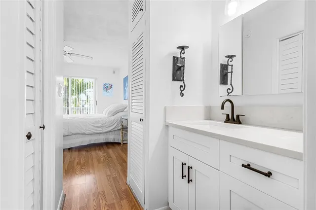 a en suite bathroom with a toilet sink and mirror