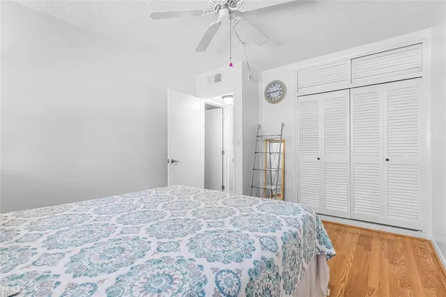 a large bed in a white room