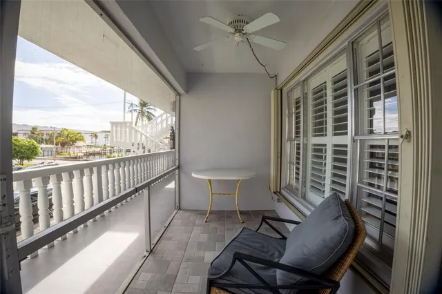 a view of a balcony with furniture