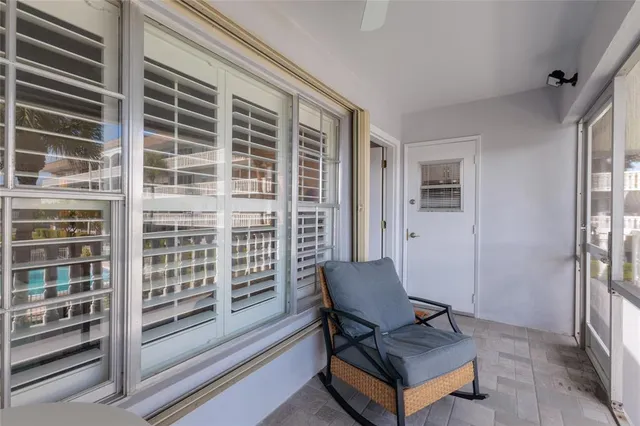 a view of a livingroom with furniture and staircase