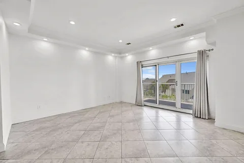 a view of an empty room with a sliding door